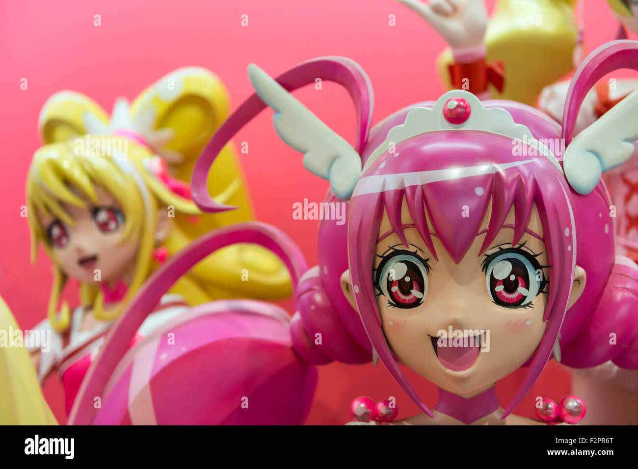 A large 3D model of a colourful Japanese anime girl character in a display  of manga style art Stock Photo - Alamy