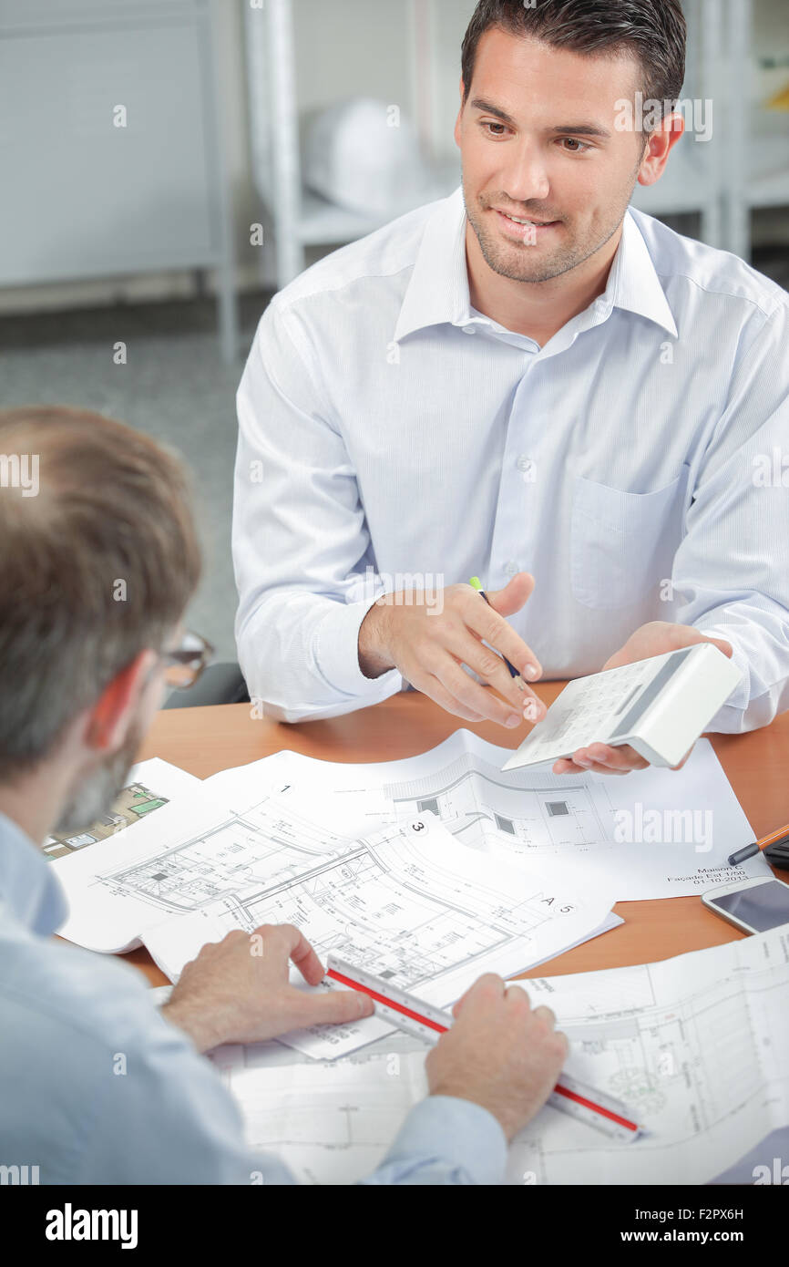 Architect explaining costs client hi-res stock photography and images ...