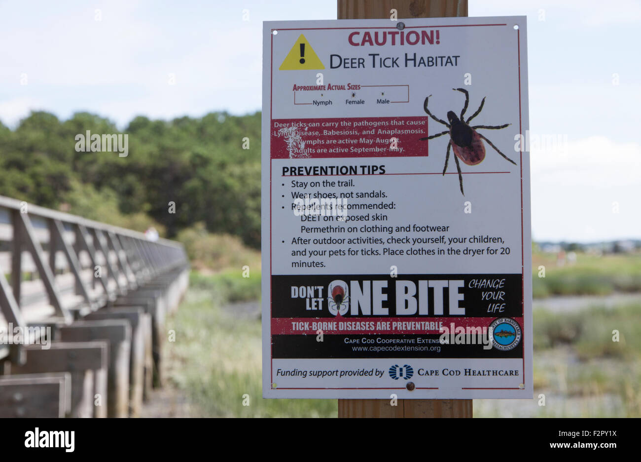 Caution sign warning of deer ticks on Cape Cod, Massachusetts. Stock Photo