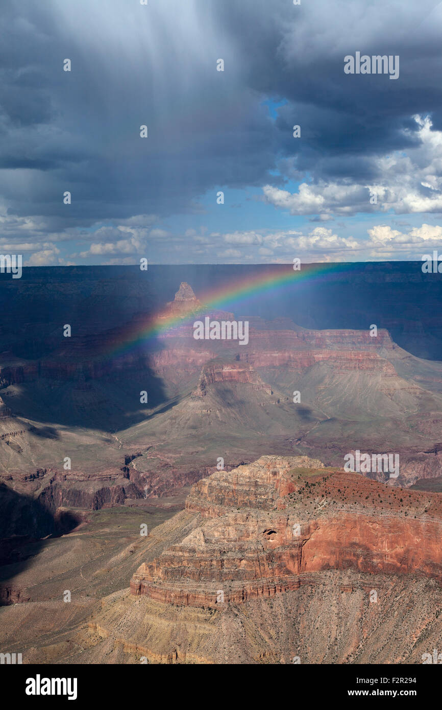 Virga from a summer rain shower creates a rainbow over the Grand Canyon