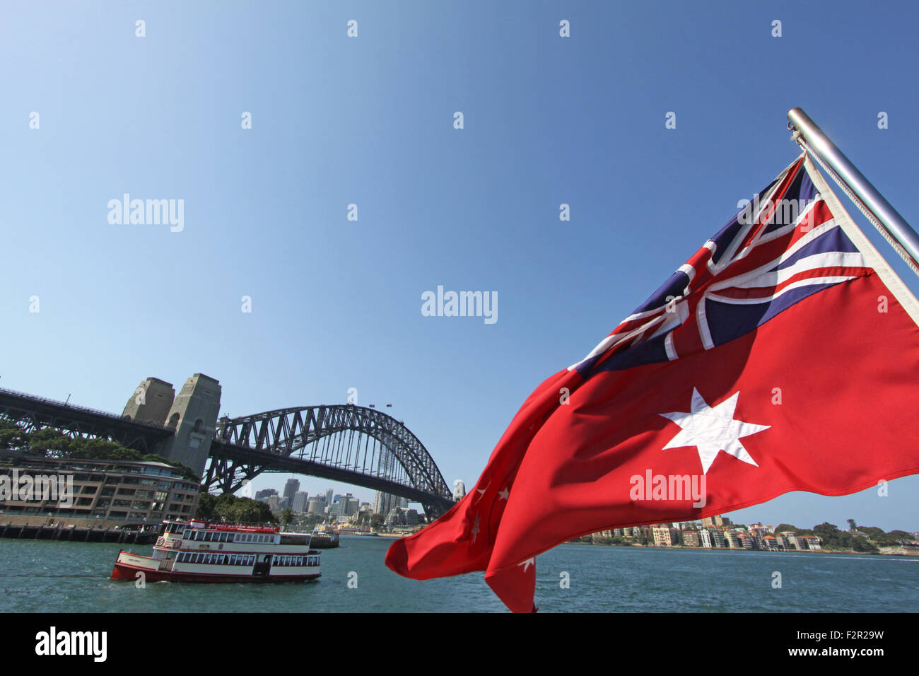The Australian Red Ensign flag blowing in the wind against the Sydney Stock  Photo - Alamy