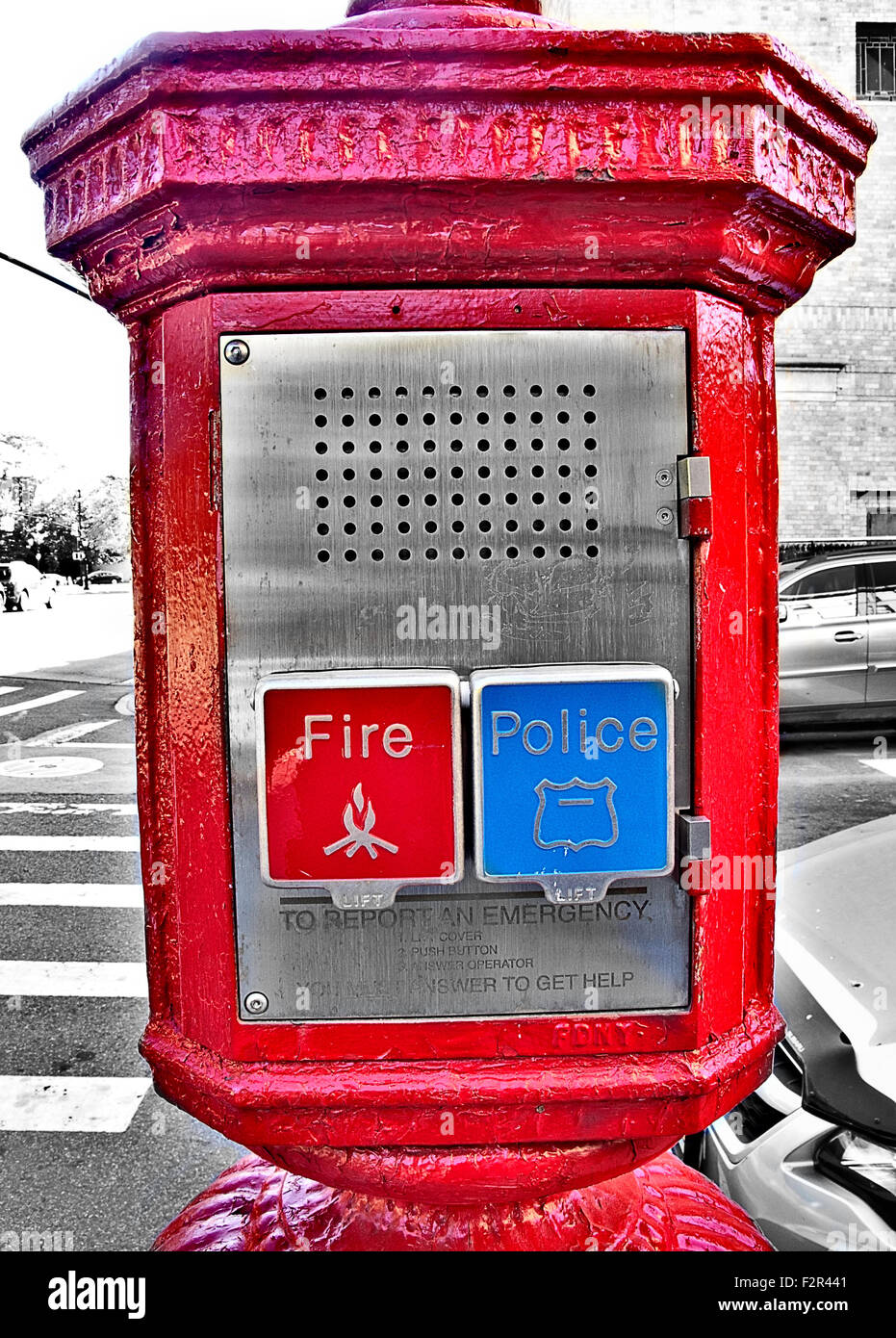 Public emergency call box phone with red fire department and blue