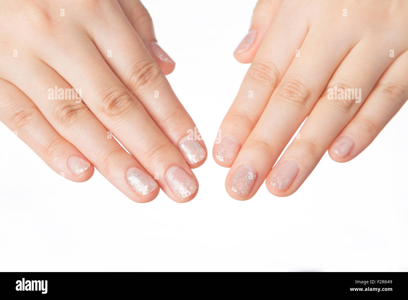 Beautiful woman's nails with manicure on white background Stock Photo