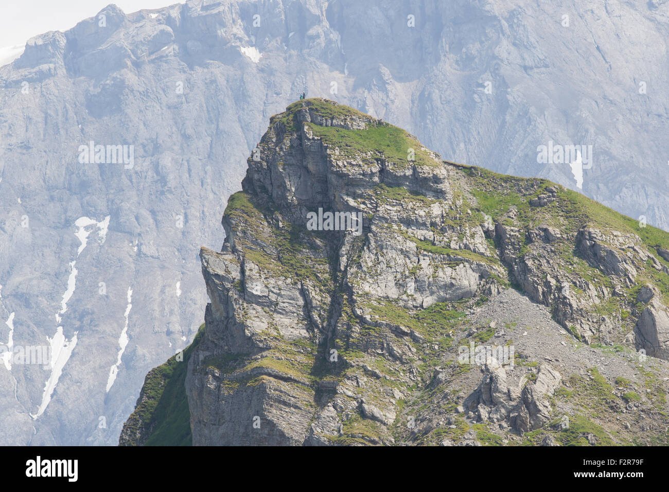 Typical view of the Swiss alps, people on top of a mountain Stock Photo ...