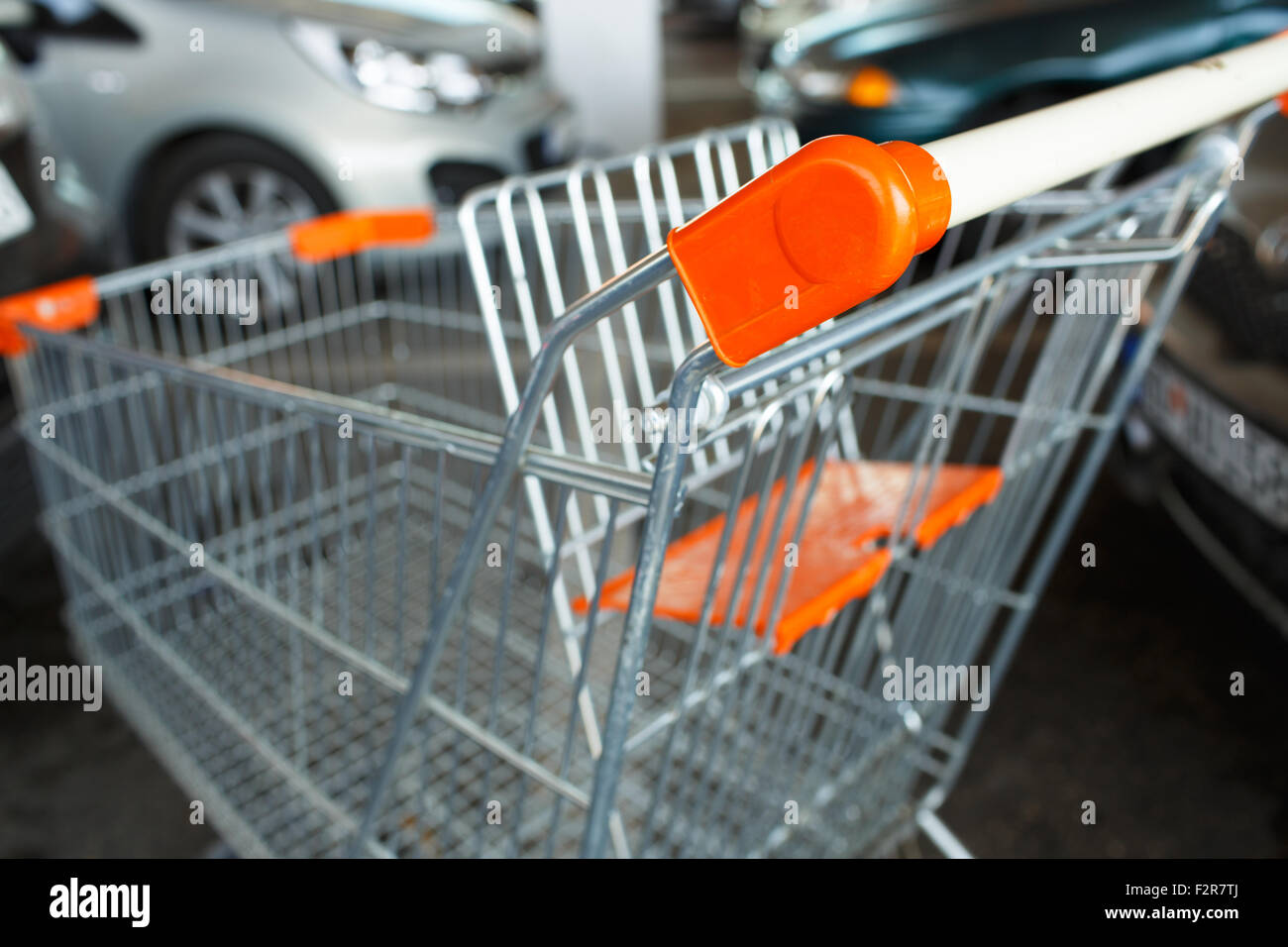 Orange shopping cart at the parking Stock Photo Alamy