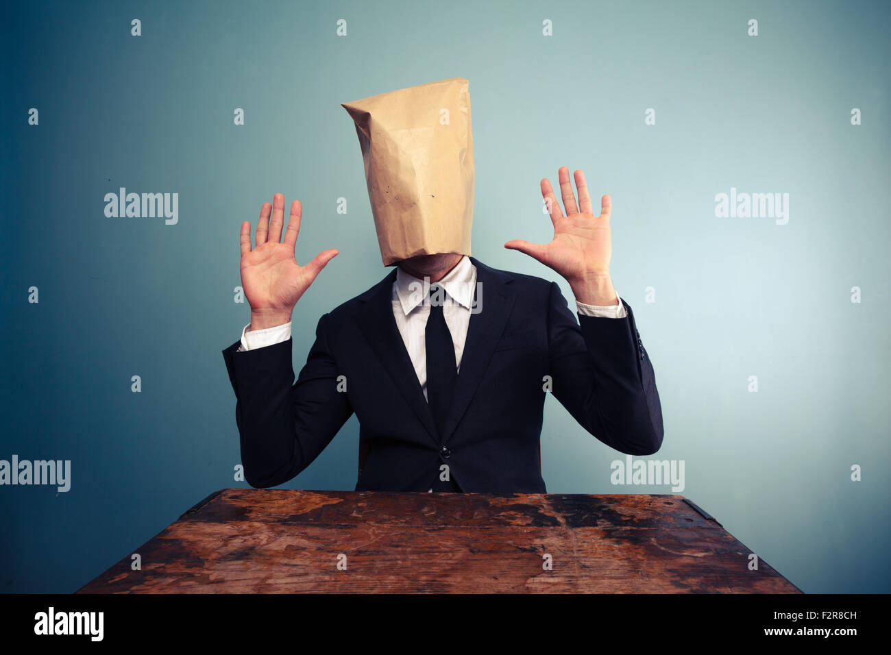 Scared businessman with a paper bag over his head Stock Photo - Alamy