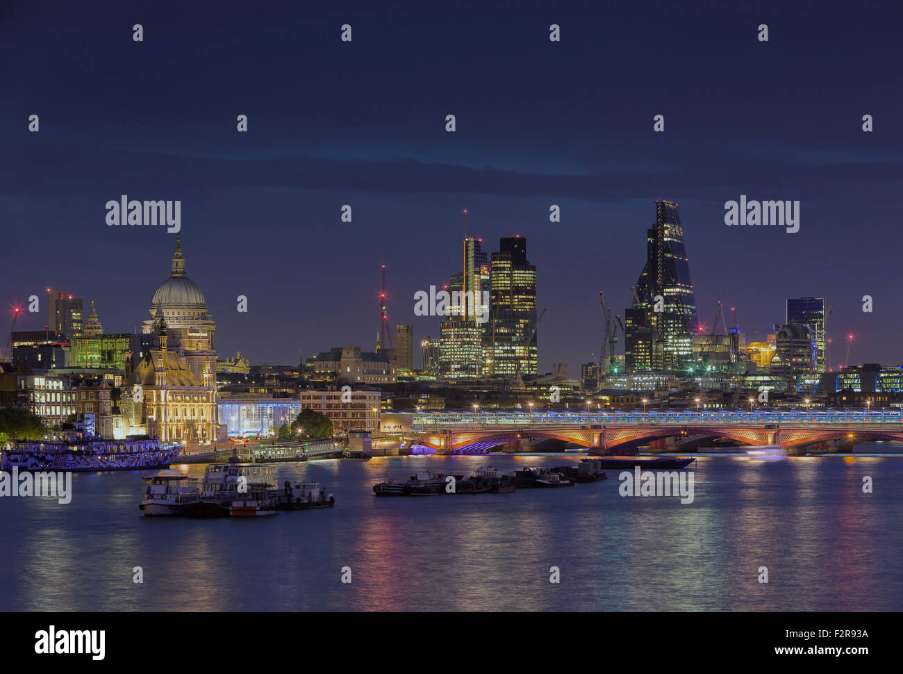 London skyline and river Thames at night, London, England Stock Photo