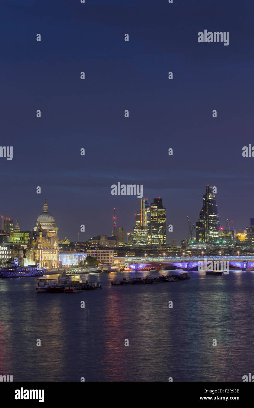 London skyline and river Thames at night, London, England Stock Photo