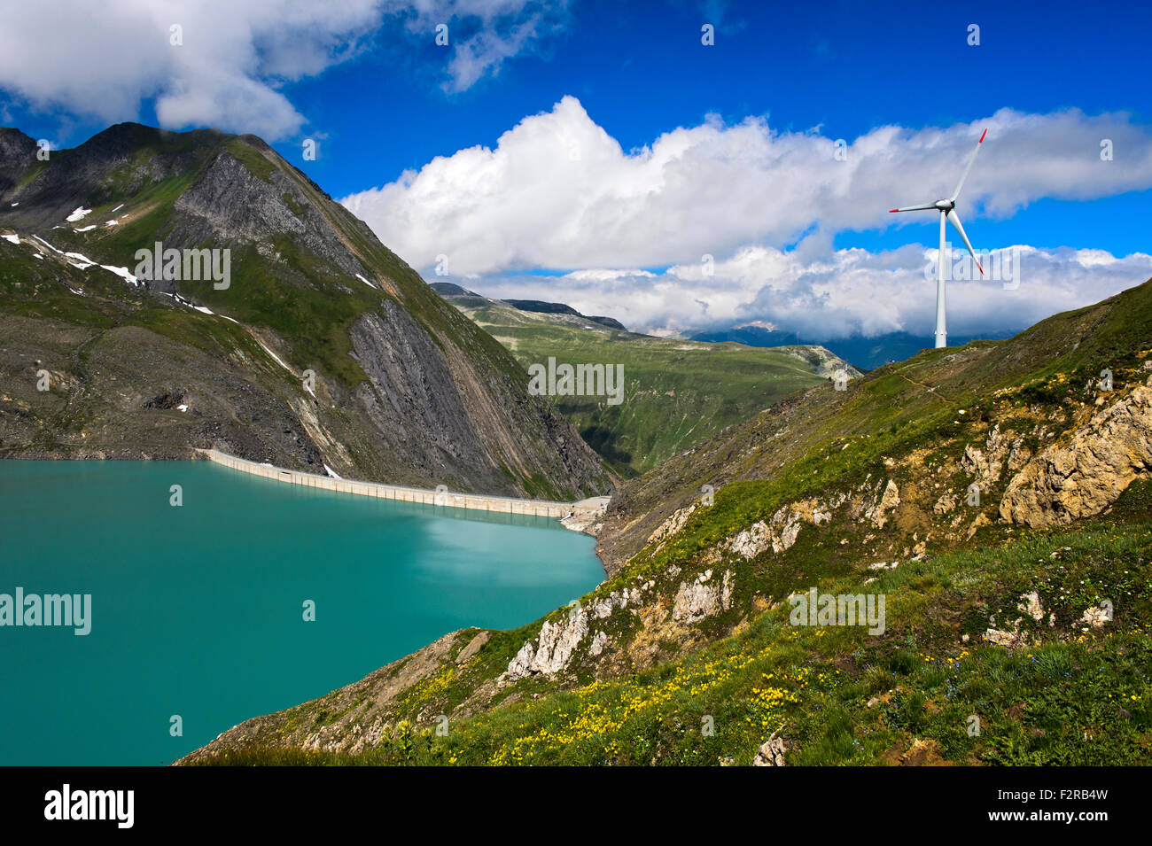 Water dam Griessee and the highest-located wind turbine in Europa, Obergoms, Nufenen Region, Valais, Switzerland Stock Photo