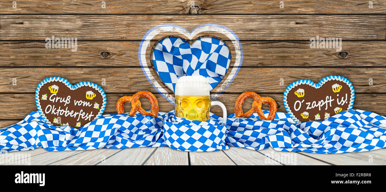 german oktoberfest beer mug gingerbread hearts and pretzel in bavarian flag Stock Photo