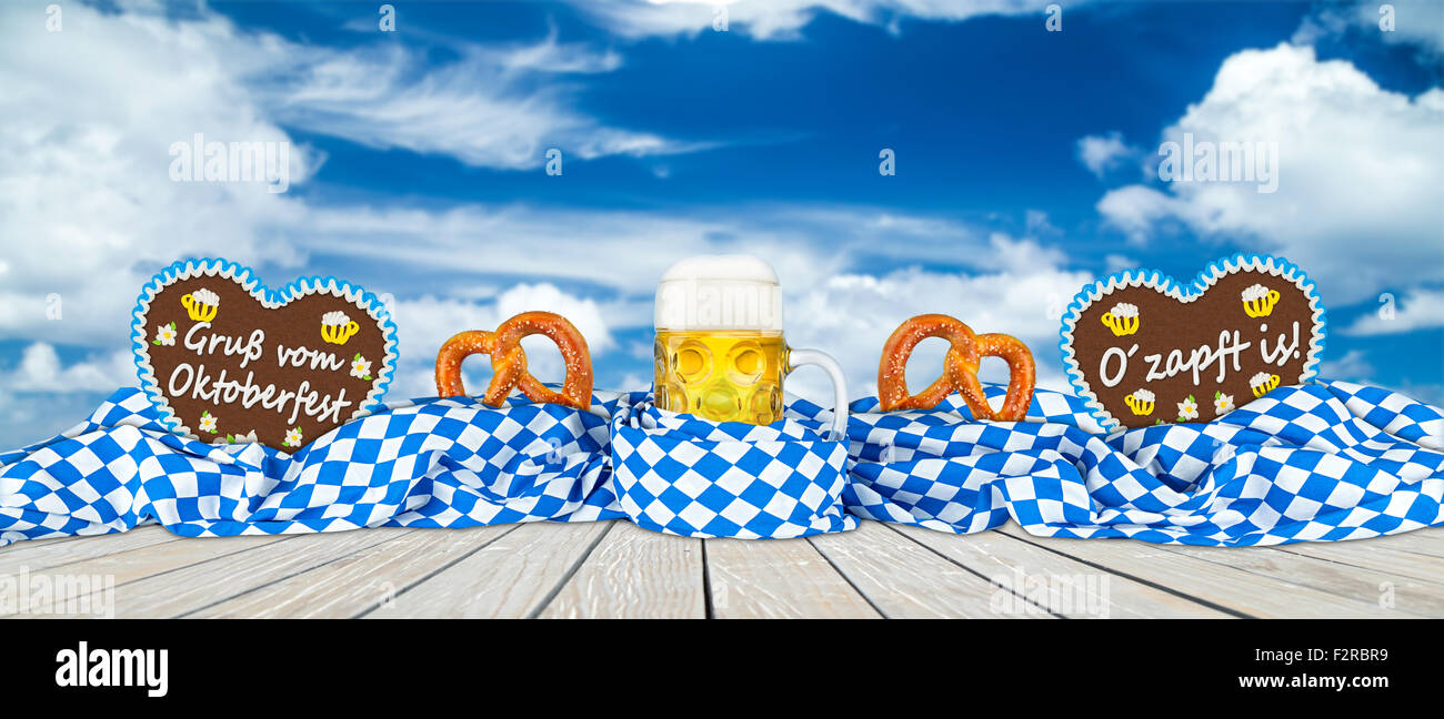 german oktoberfest beer mug gingerbread hearts and pretzel in bavarian flag Stock Photo