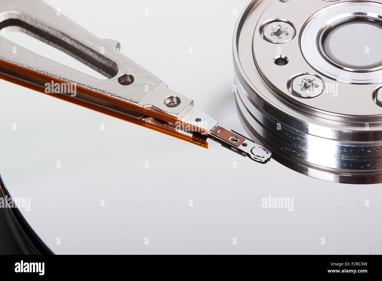 closeup of opened hard drive disk isolated on the white background Stock Photo
