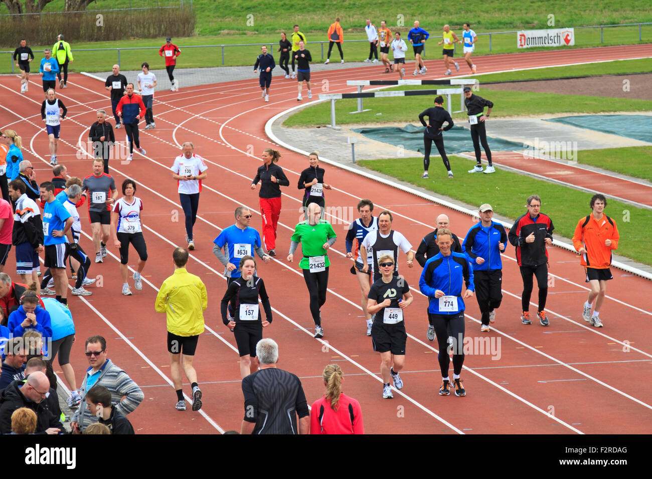 The 65th editing Dwars door Dordt on Sunday 1 April 2012. Runners warming up on the track at the sports stadium Stock Photo