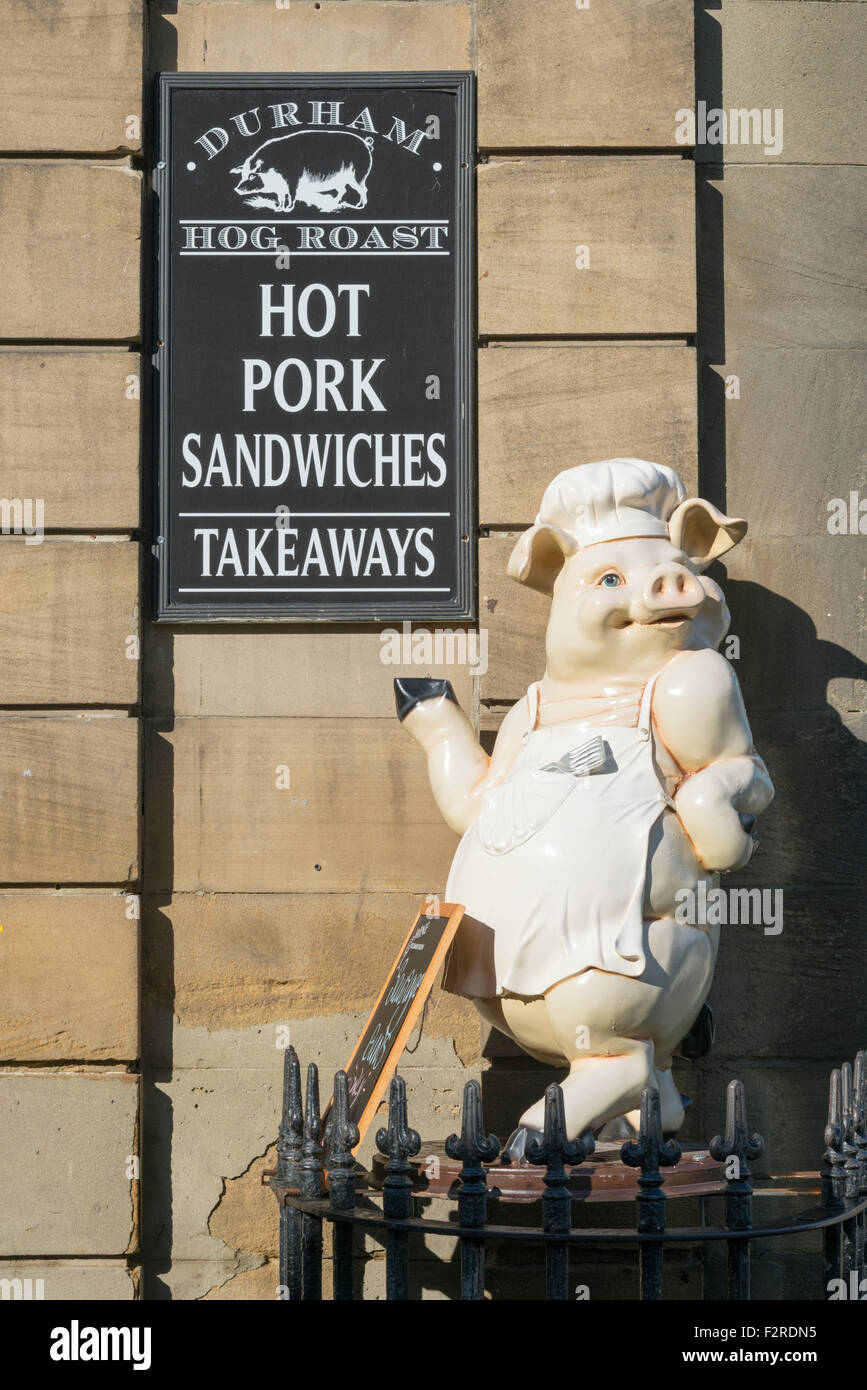 A sign an pig advertising takeaway hog roast sandwiches pork and food at Durham UK Stock Photo