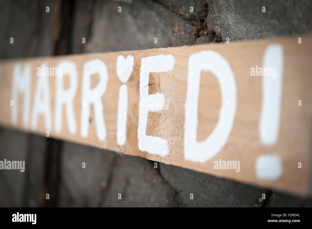 A handmade wooden wedding sign with the word married painted on it Stock Photo