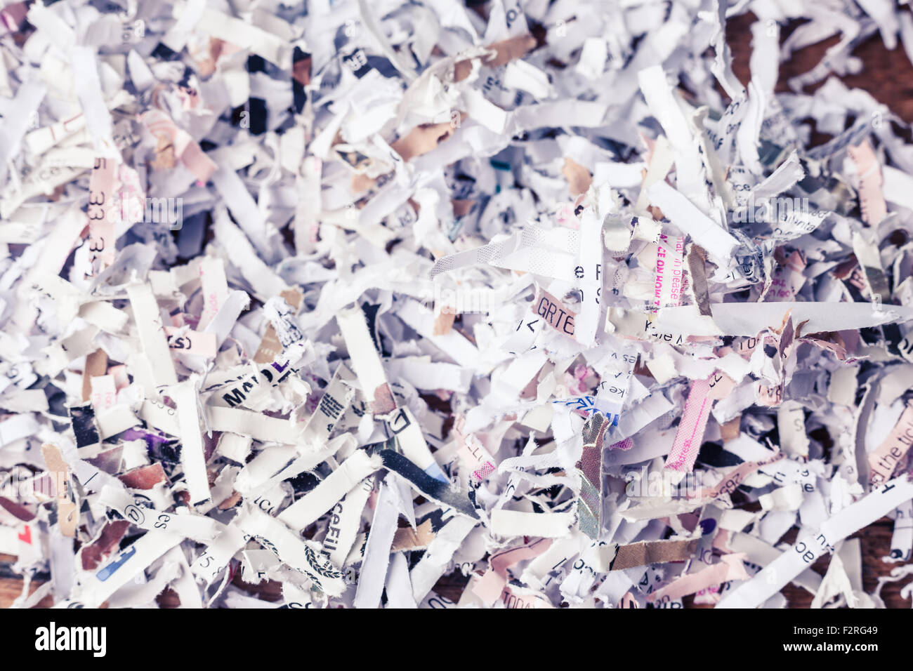 Paper cut into tiny pieces by cross shredder Stock Photo Alamy