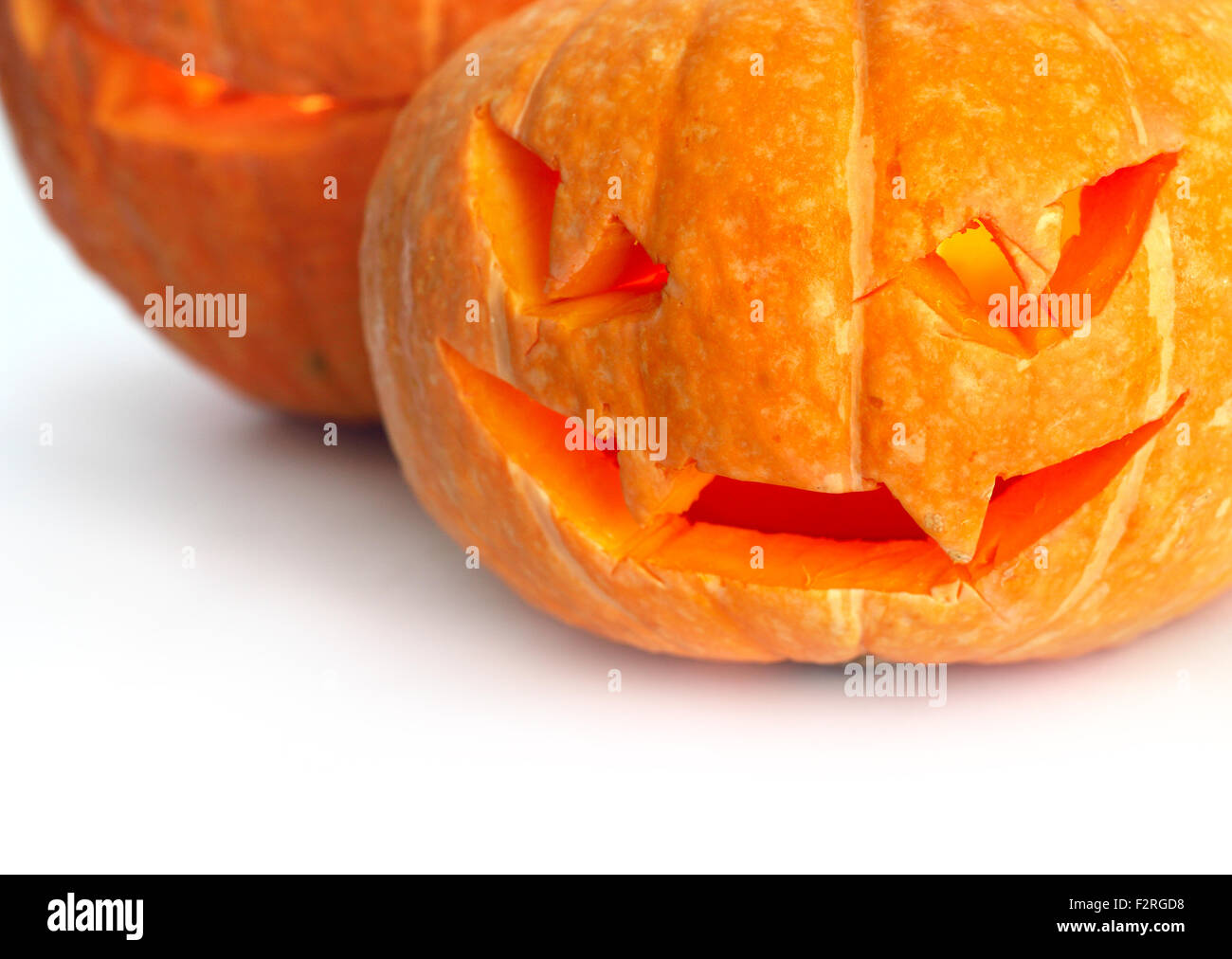 Glowing Halloween Pumpkins isolated on white background Stock Photo - Alamy