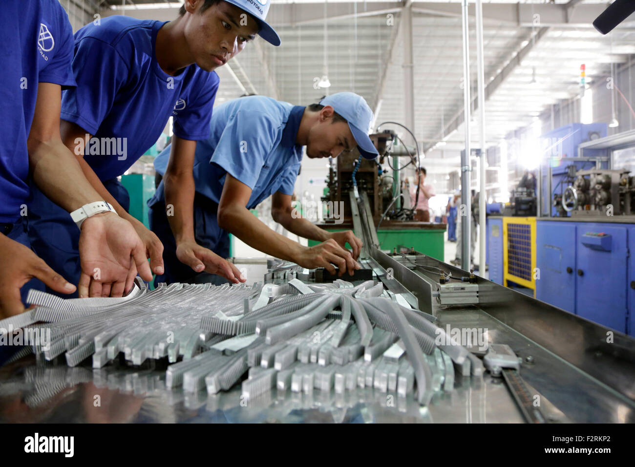 Yangon, Myanmar. 23rd Sep, 2015. Factory workers work at the Thilawa Special Economic Zone in southern Yangon, Myanmar, Sept. 23, 2015. © U Aung/Xinhua/Alamy Live News Stock Photo