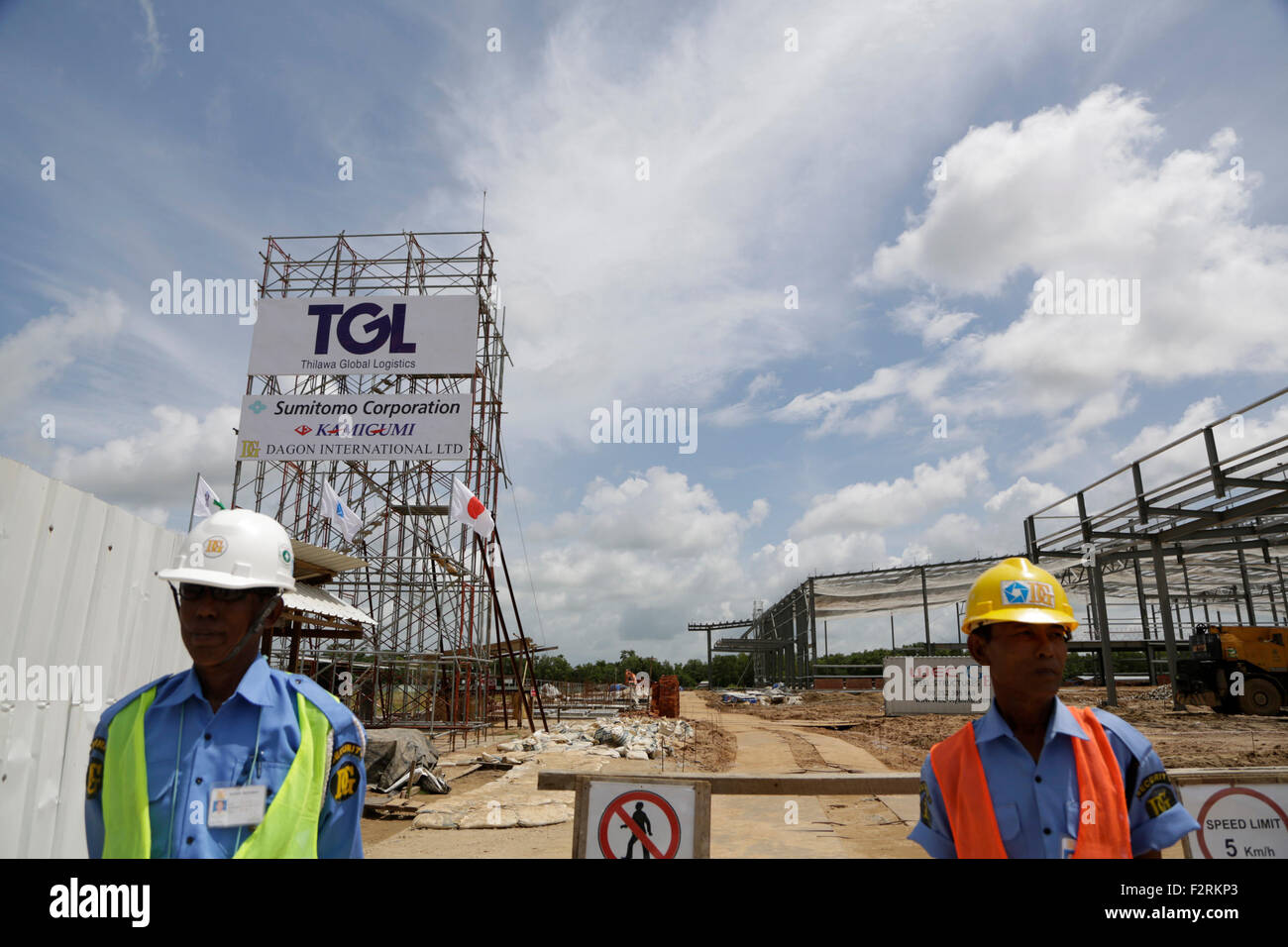 Yangon, Myanmar. 23rd Sep, 2015. Security personnel stand in front of a construction site at the Thilawa Special Economic Zone in southern Yangon, Myanmar, Sept. 23, 2015. © U Aung/Xinhua/Alamy Live News Stock Photo