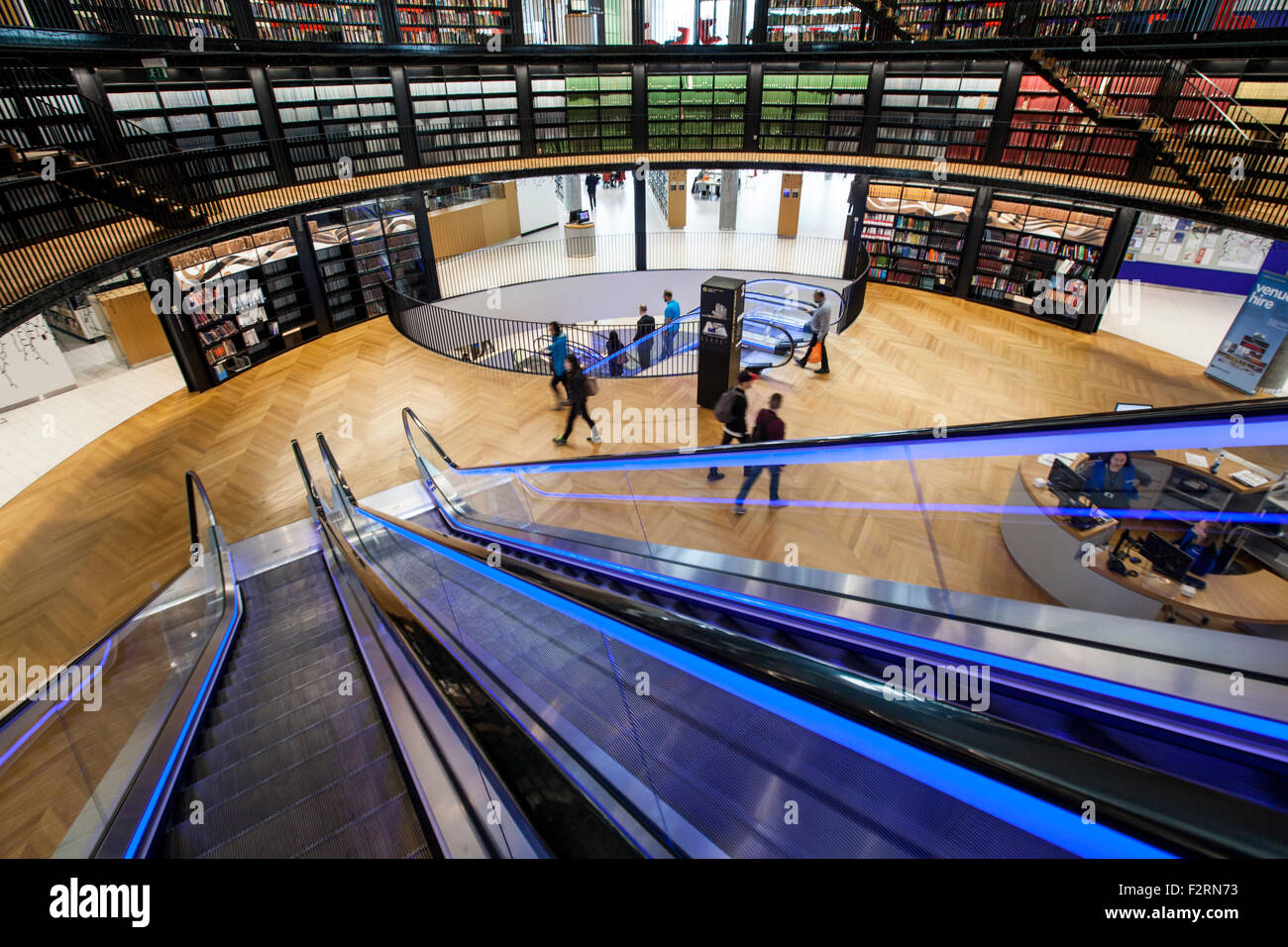The illuminated escalators in the new Library of Birmingham, England Stock Photo