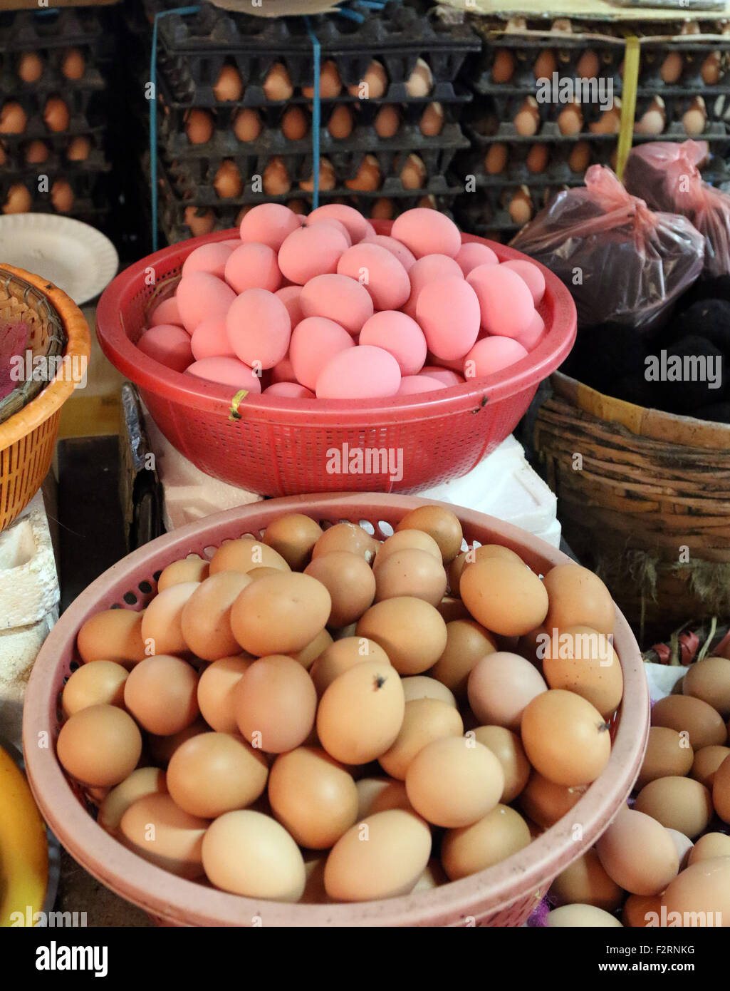 pink eggs for sale market stall bowl Stock Photo