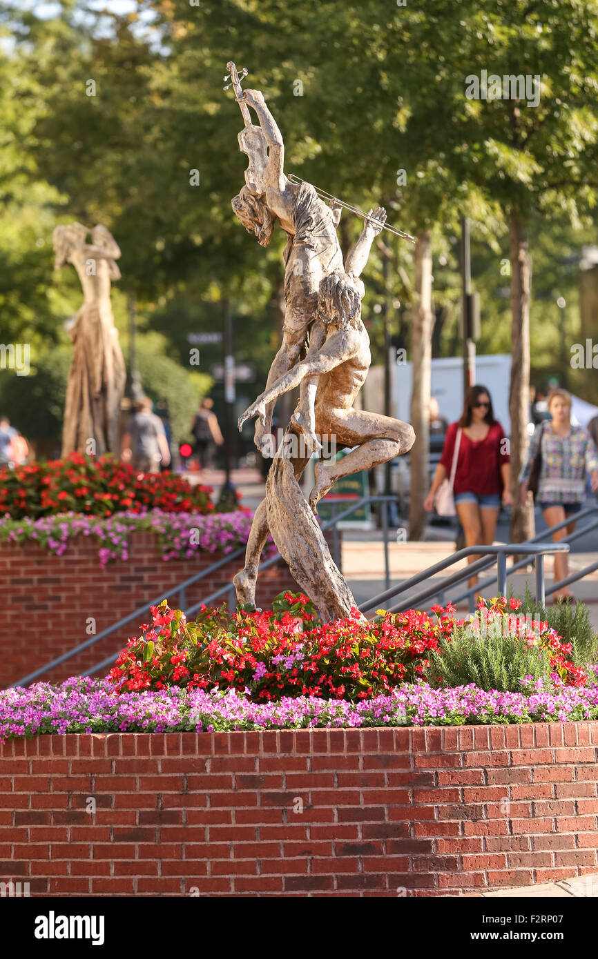 Reminiscence by sculpture Tuan along Main Street in downtown Greenville, South Carolina. Stock Photo