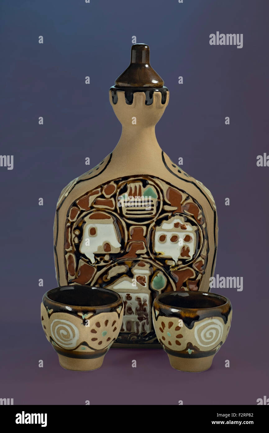 Painted ceramic carafe and two cappies Stock Photo