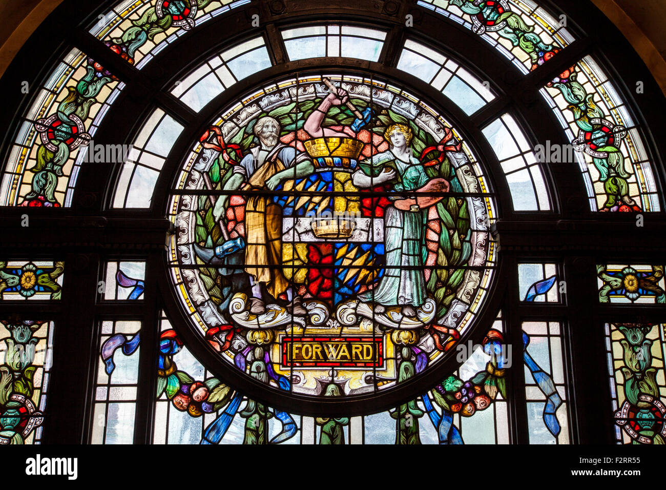 A stained glass window with the 'Birmingham Coat of Arms' in the