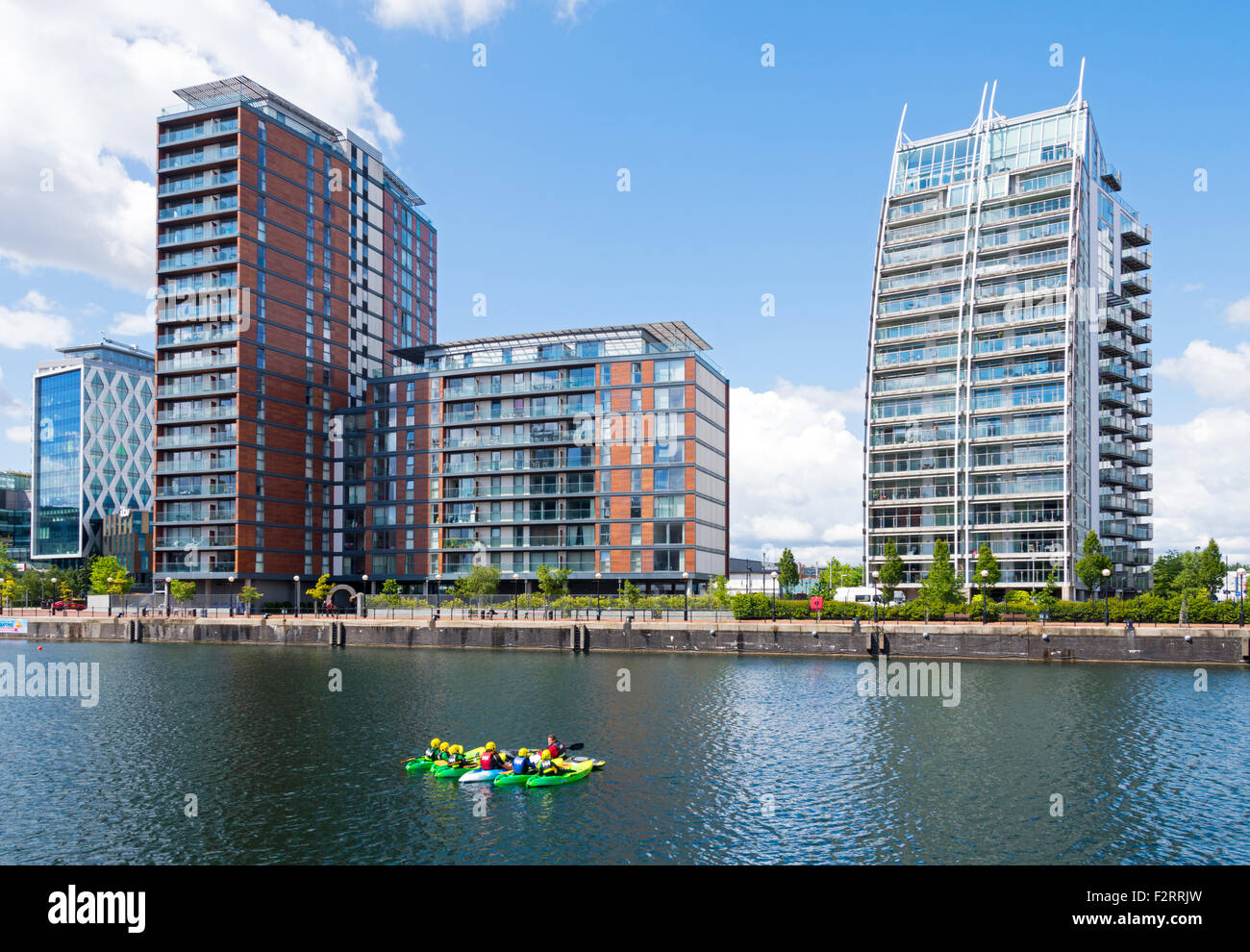 The City Lofts and NV apartments blocks over Huron Basin, Salford Quays, Manchester, England, UK Stock Photo