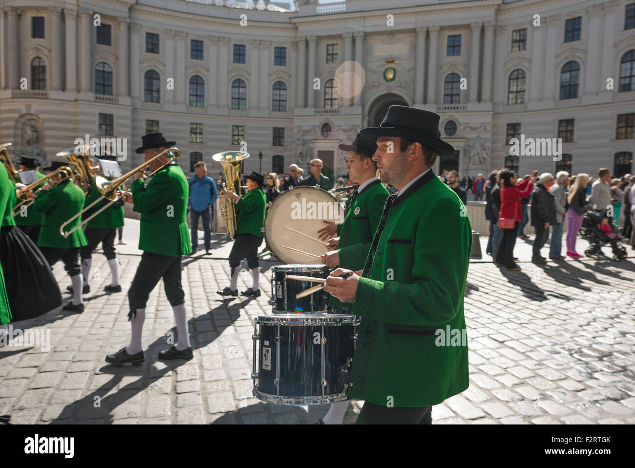 Tyrolean band, a band of Tyrolean musicians march past the Michaelerplatz entrance to the Hofburg Palace in Vienna, Austria. Stock Photo