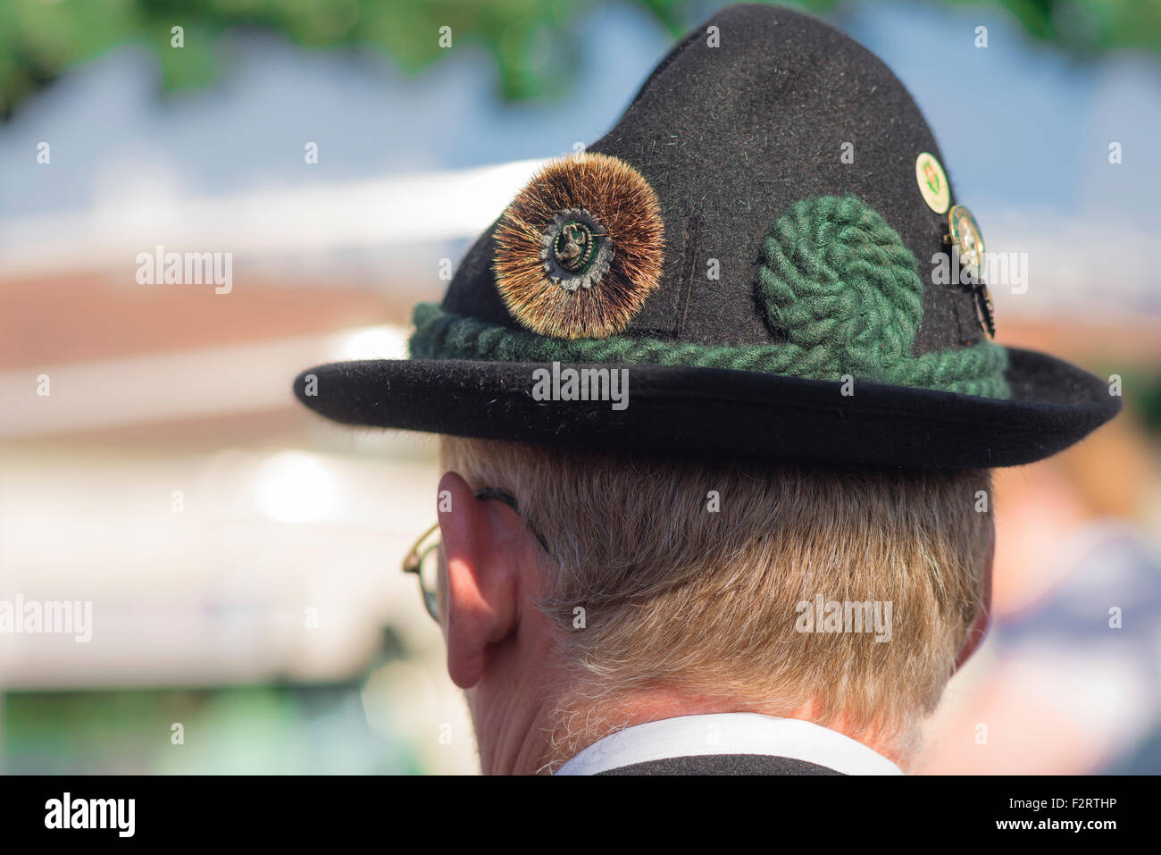 Tyrolean hat Austria, view of a man wearing a traditional Tyrolean green felt hat known as an alpen-schatz, Vienna, Wien, Austria. Stock Photo