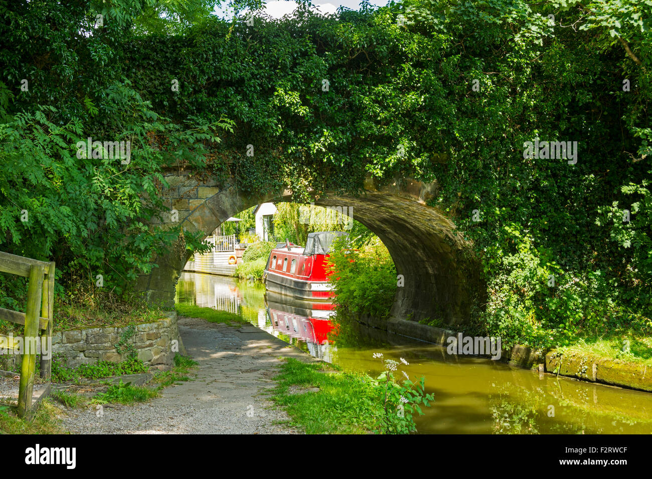 Narrowboat and bridge on the Macclesfield canal at Marple, Greater Manchester, England, UK. Stock Photo