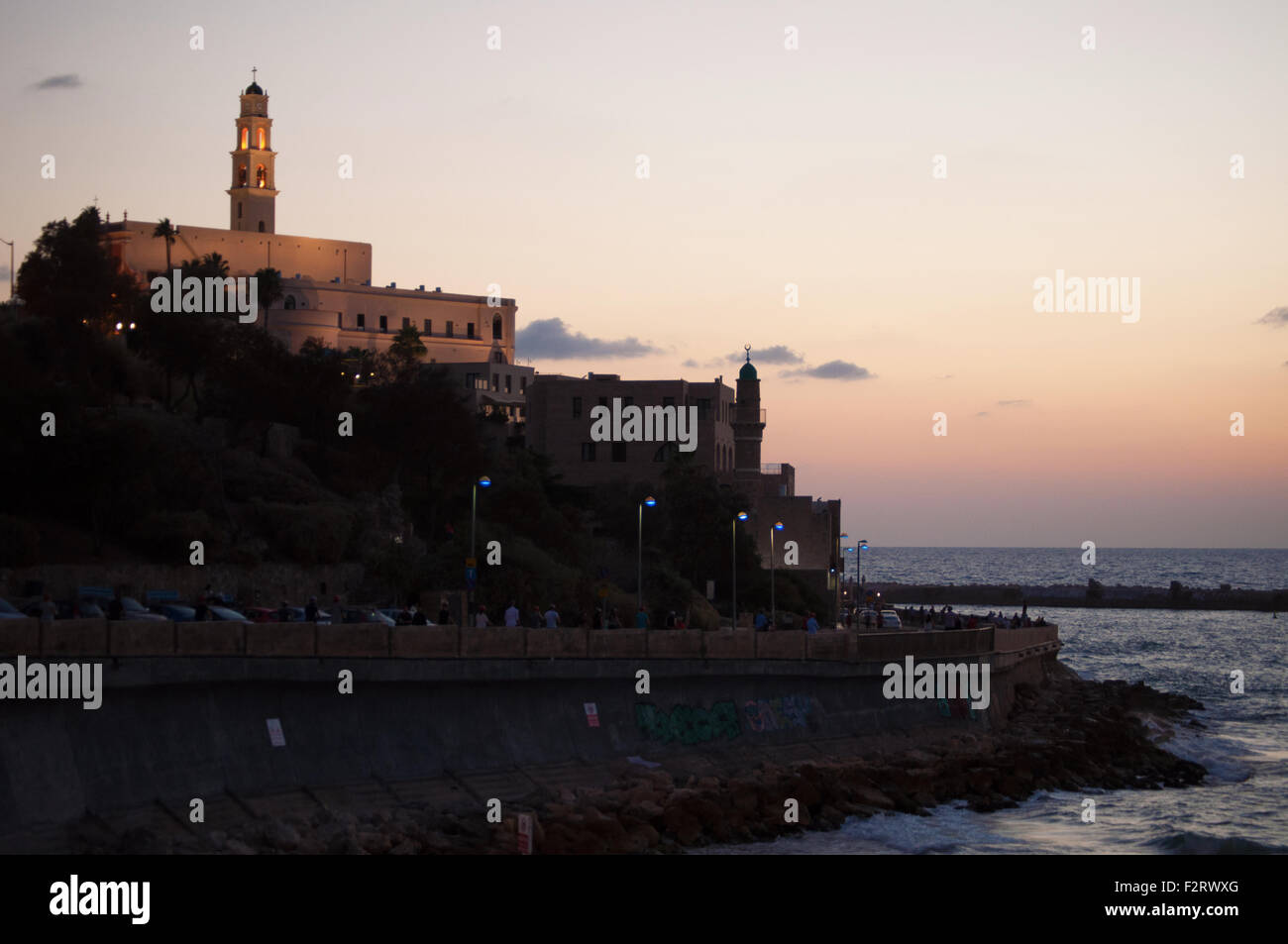 Summer day, sunset on the tower bell of Saint Peter Church and the Great Mosque, Old Jaffa, Yafo, Yaffo, Tel Aviv, Israel Stock Photo