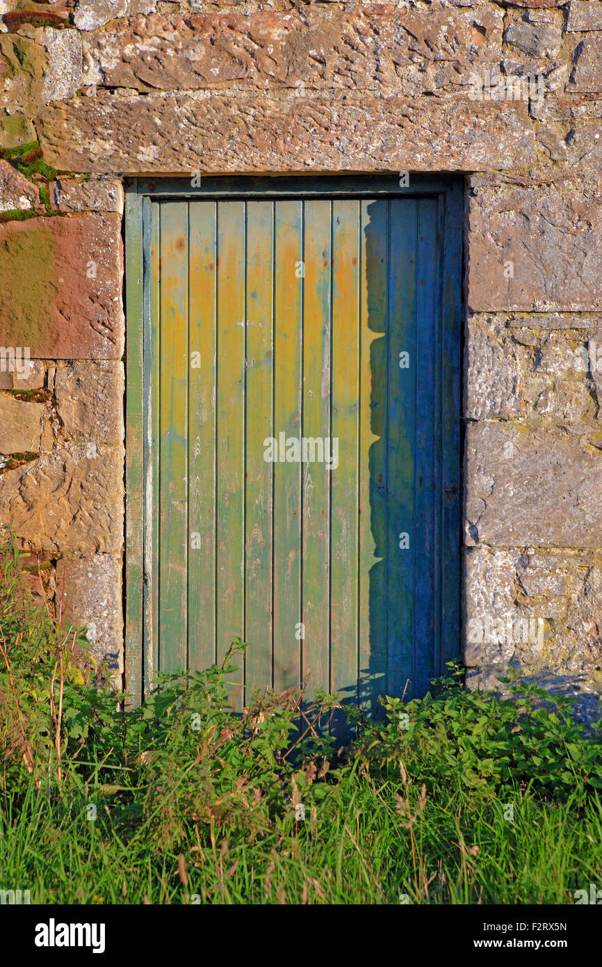 Old barn door in late afternoon sunshine Stock Photo
