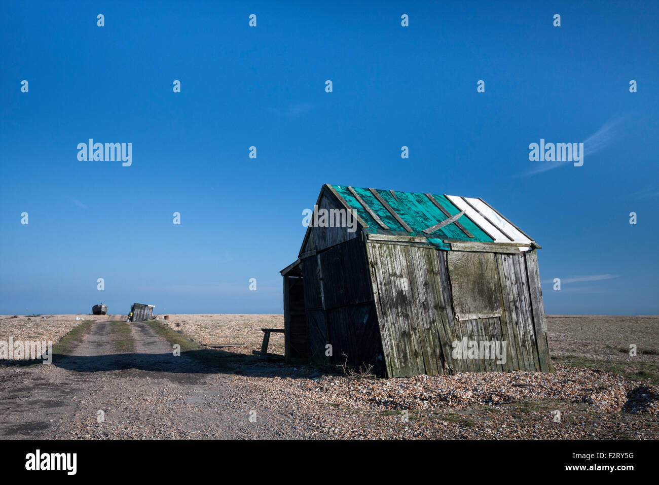 Abandoned old fishing hut and path on the shingle beach, Dungeness ...