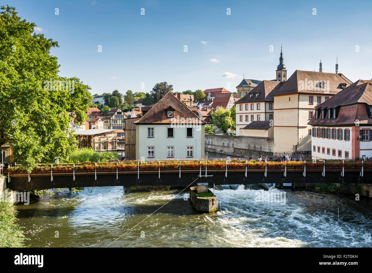 BAMBERG, GERMANY - SEPTEMBER 4: Tourists on a bridge over the river Regnitz in Bamberg, Germany on September 4, 2015. Stock Photo