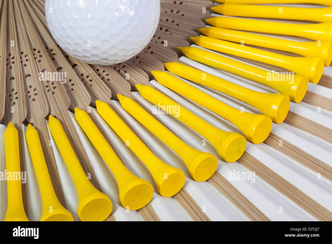 Typical Japanese hand fan made of bamboo and golf equipments Stock