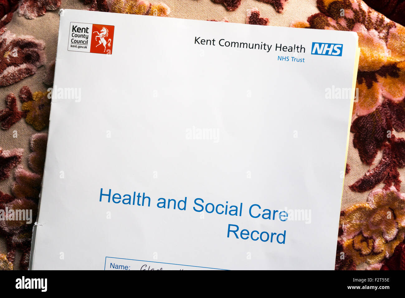 A set of Health and Social Care Records for an elderly lady, a patient of the Kent Community Health NHS Trust. Stock Photo