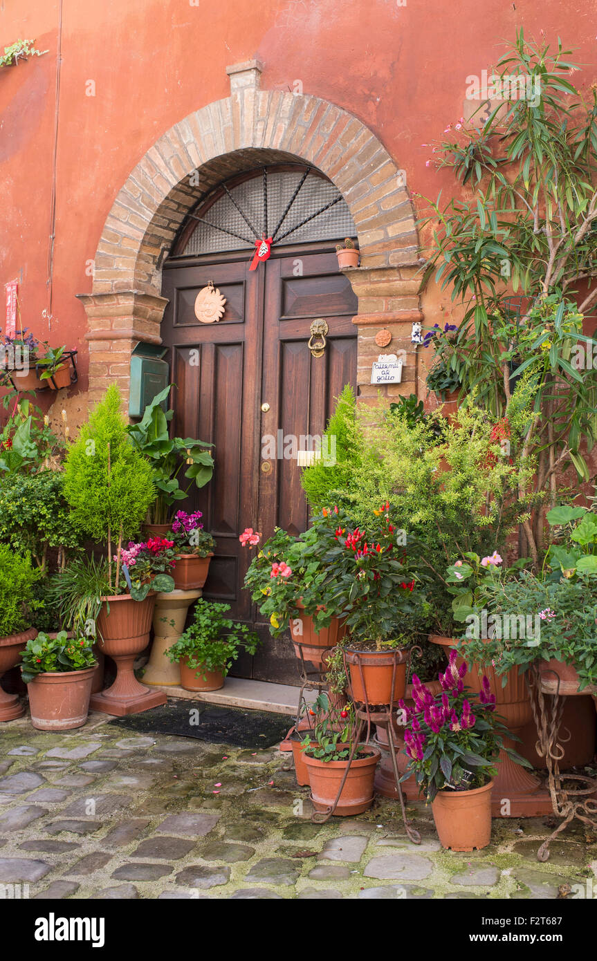 House with Street Garden of Pots and Hanging Baskets in Amandola Italy Stock Photo