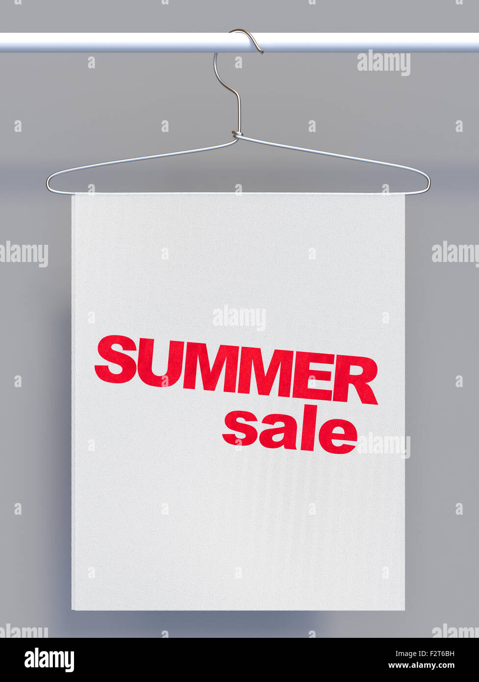 Wire hanger on clothes rail and banner with sale sign Stock Photo