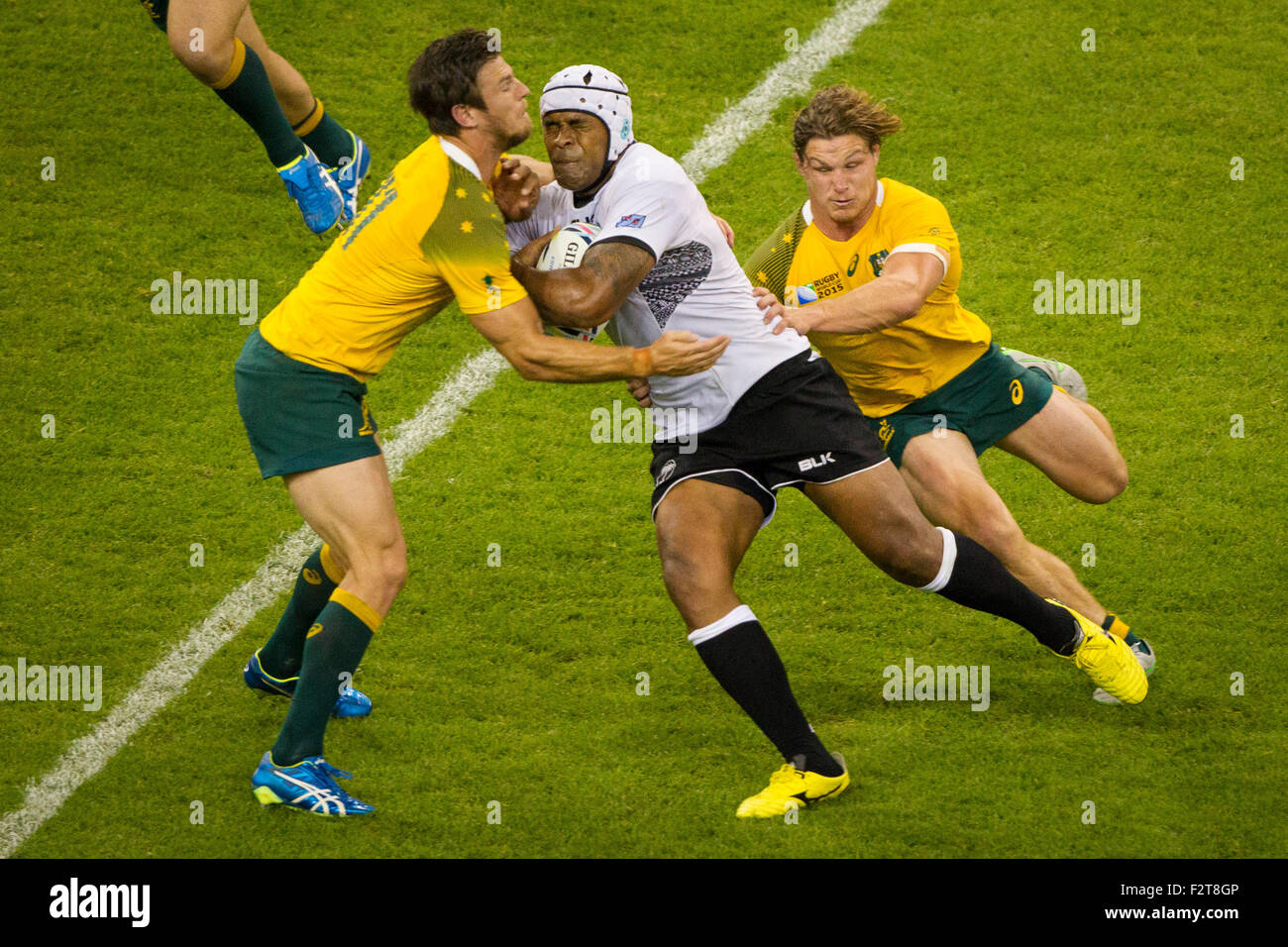 Cardiff, Wales. 23rd Sep, 2015. Rugby World Cup. Australia versus Fiji. Rob Horne attempts to stop a Fijian attacker. Credit:  Action Plus Sports/Alamy Live News Stock Photo