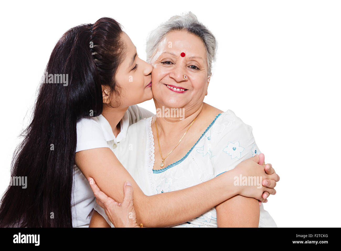 2 indian Grandmother and Granddaughter love kissing Stock Photo