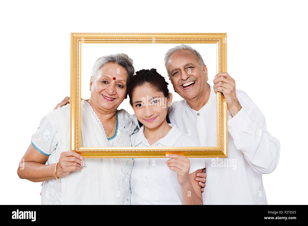 3 indian Grandparents and Granddaughter frame showing Stock Photo
