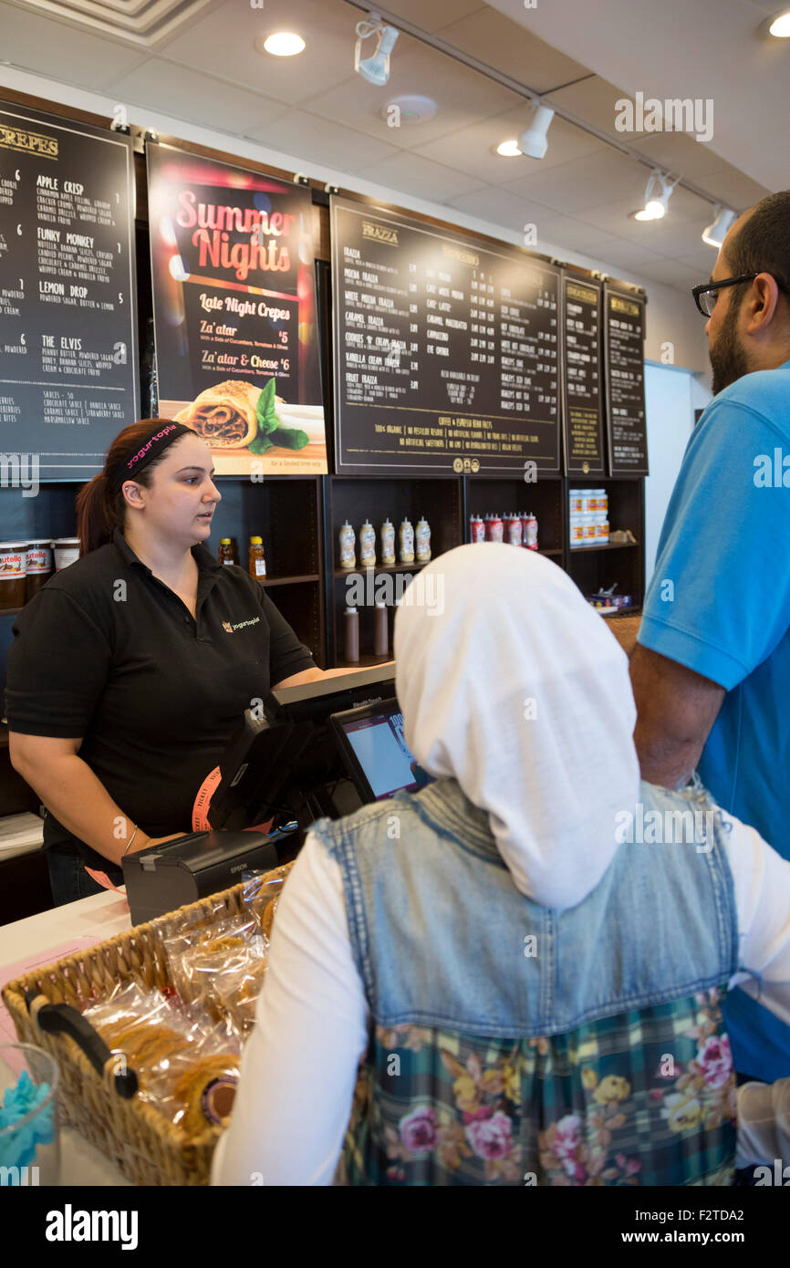 Dearborn, Michigan - A worker at the Yogurtopia frozen yogurt franchise in an Arab-American neighborhood. Stock Photo