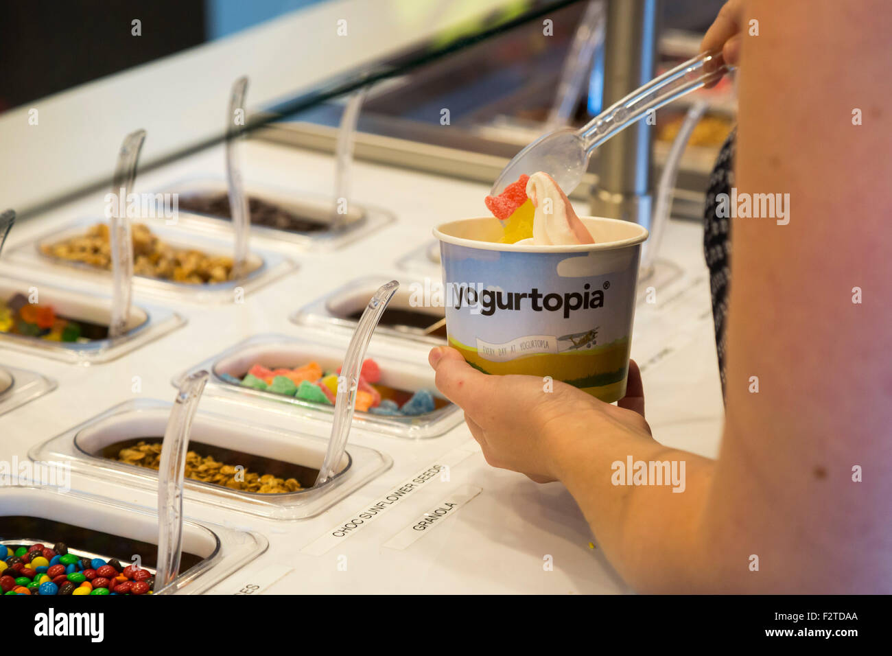 Dearborn, Michigan A customer puts toppings on frozen yogurt at a