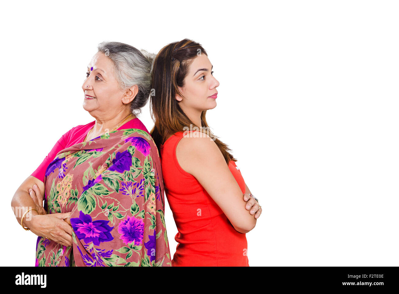 Image of Indian Mother and Daughter posing by the door-YO859031-Picxy