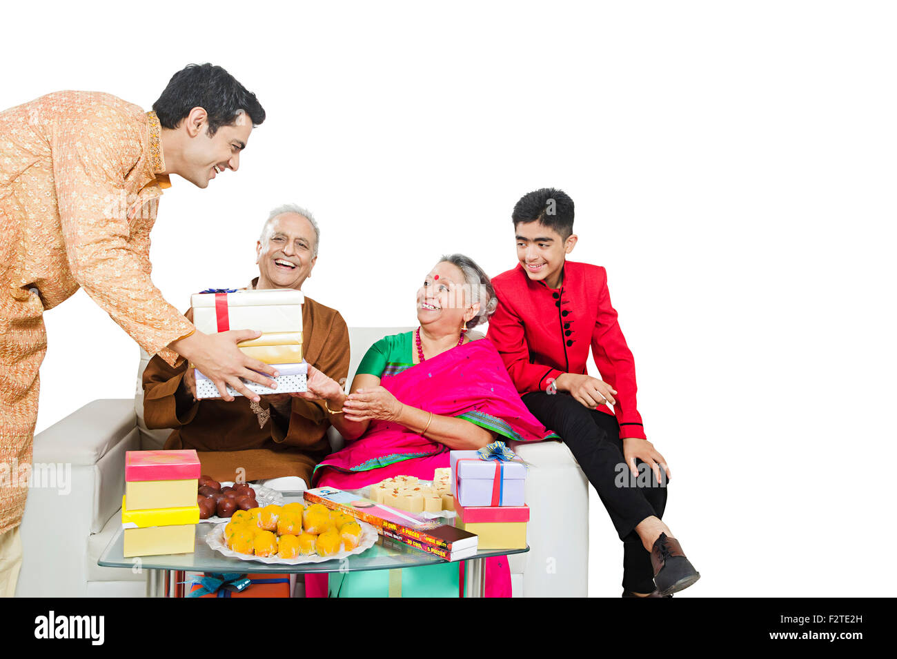 4 indian Grandson Parents and son diwali Festival gift Giving Stock Photo