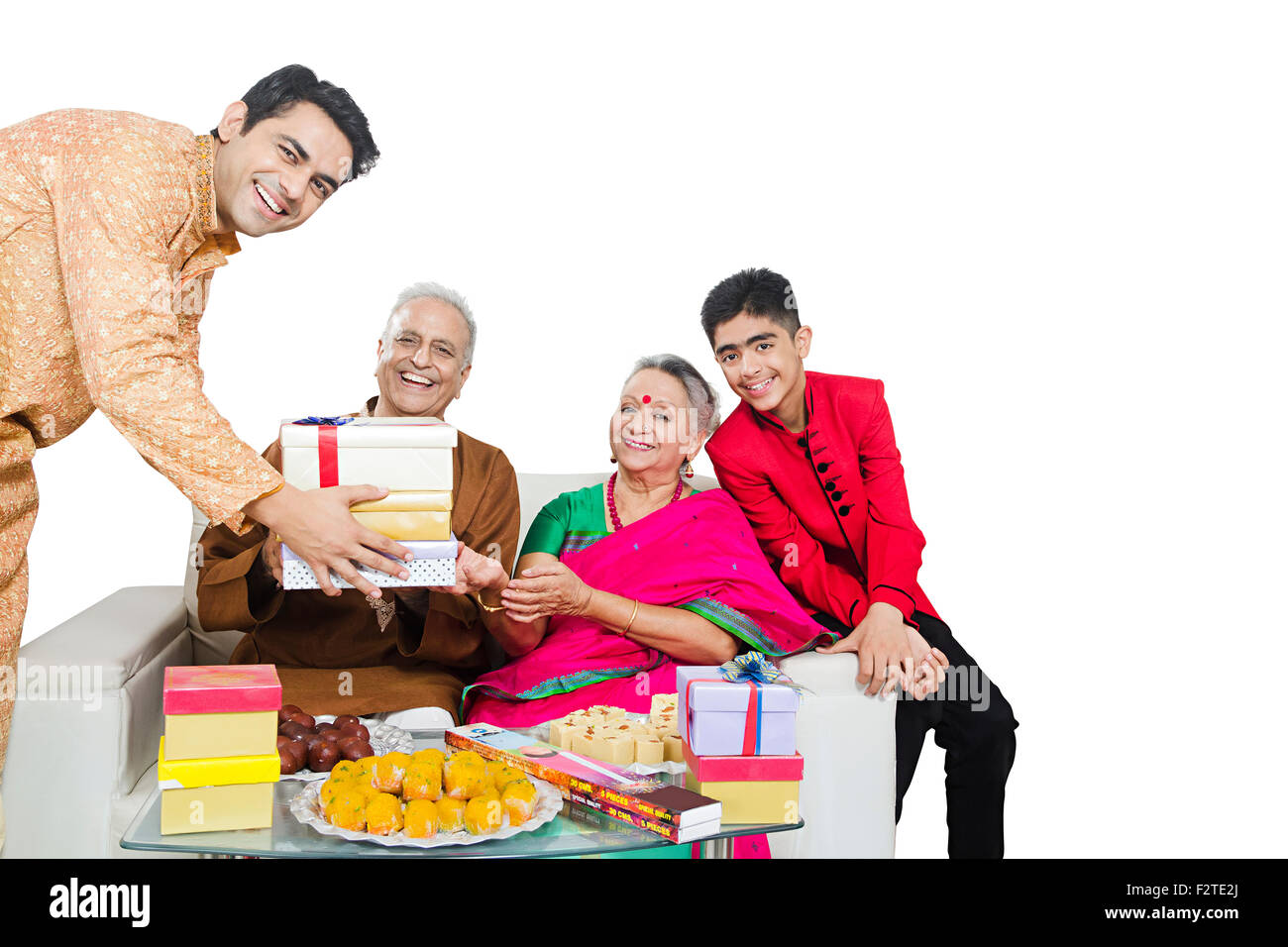 4 indian Grandson Parents and son diwali Festival gift Giving Stock Photo