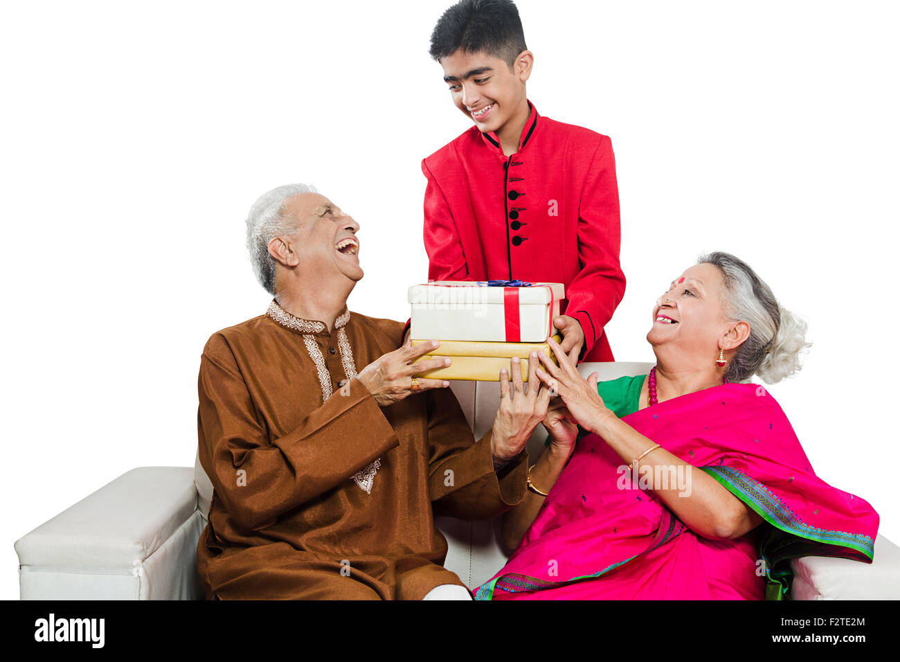 3 indian Grandparents and Grandson diwali Festival gift Giving Stock Photo