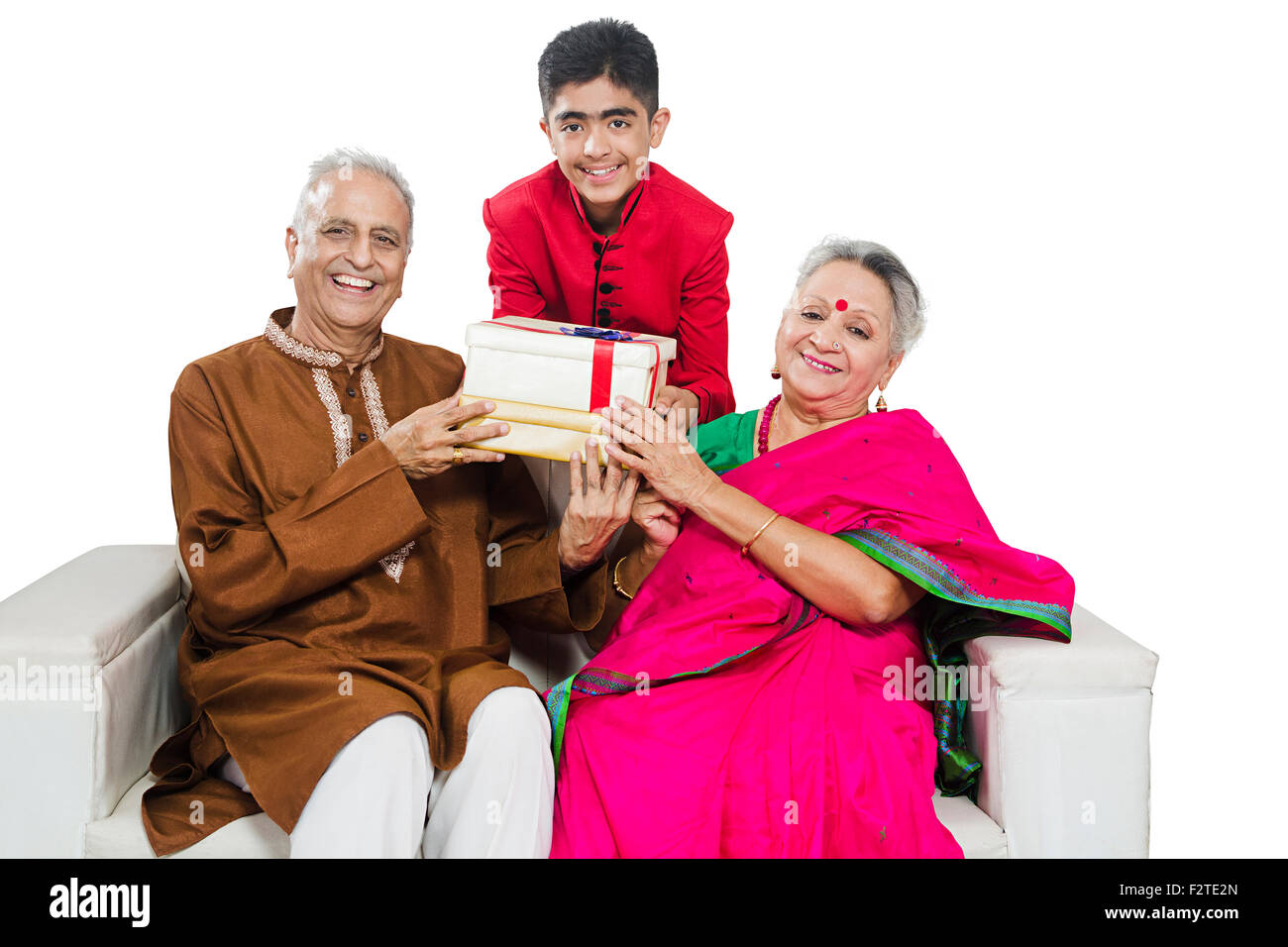 3 indian Grandparents and Grandson diwali Festival gift Giving Stock Photo